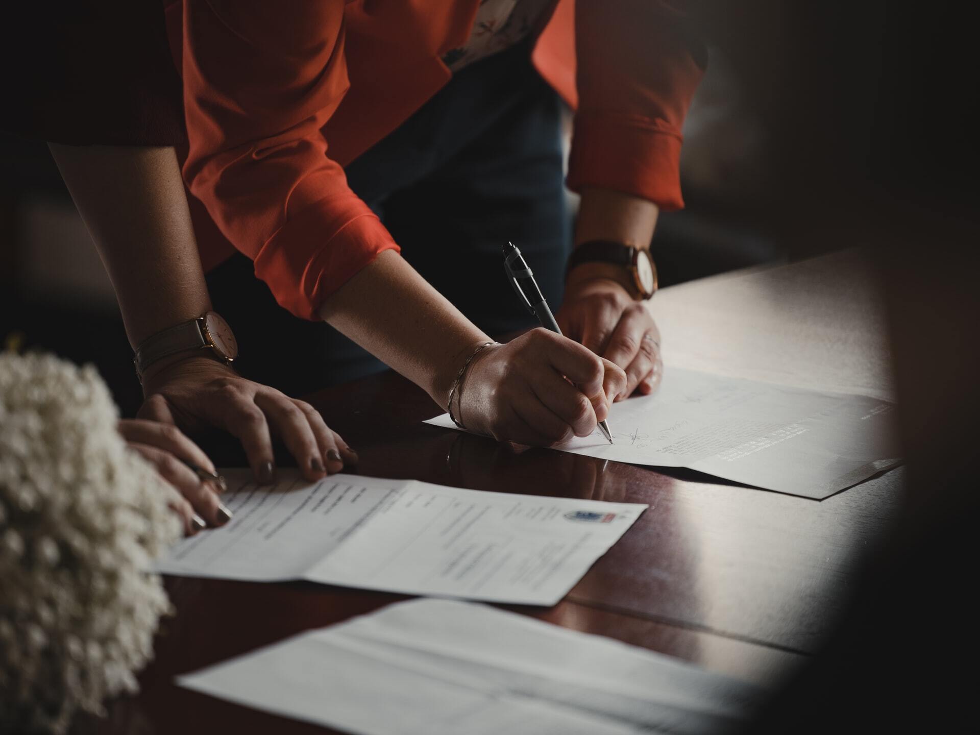 Woman signing document